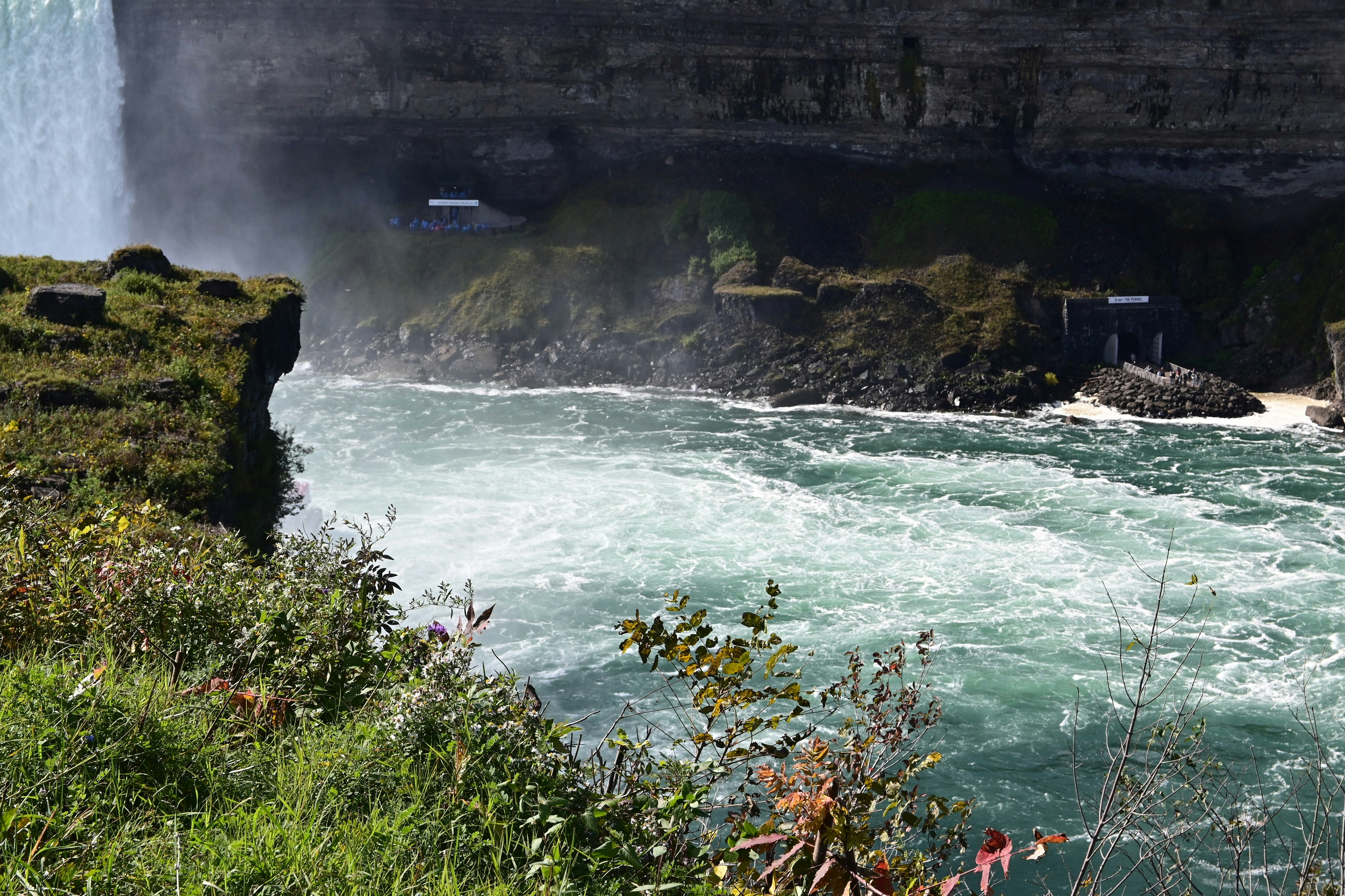 a waterfall with a waterfall in the background