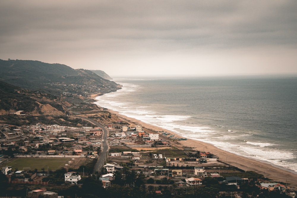 an aerial view of a beach and a city