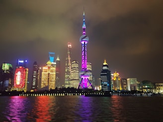 Shanghai’s skyline glowing with lights as night falls over the city.