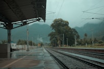 a train station with a train on the tracks