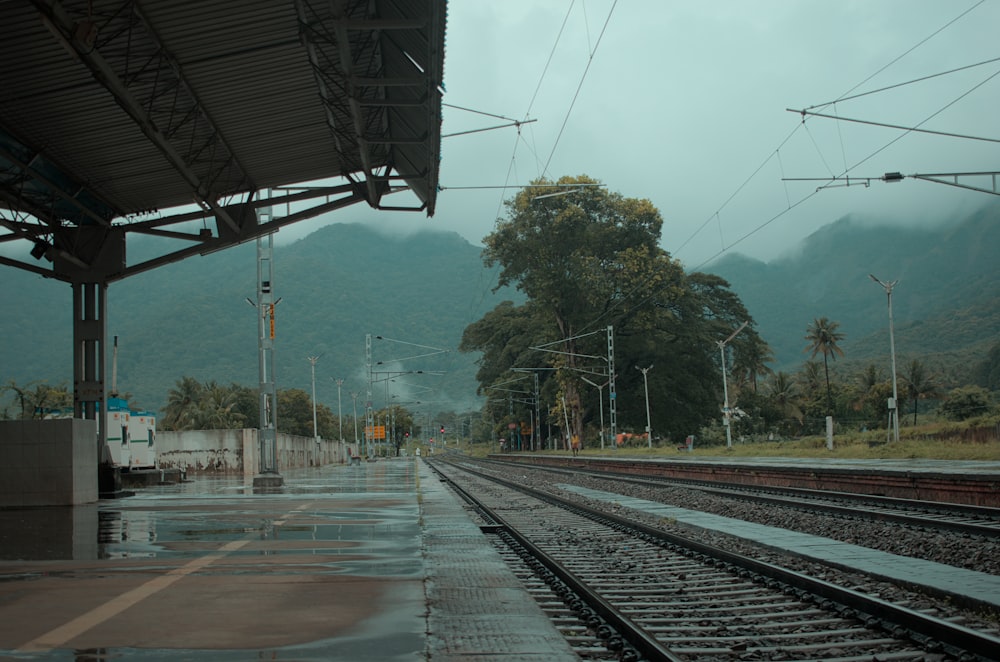 a train station with a train on the tracks