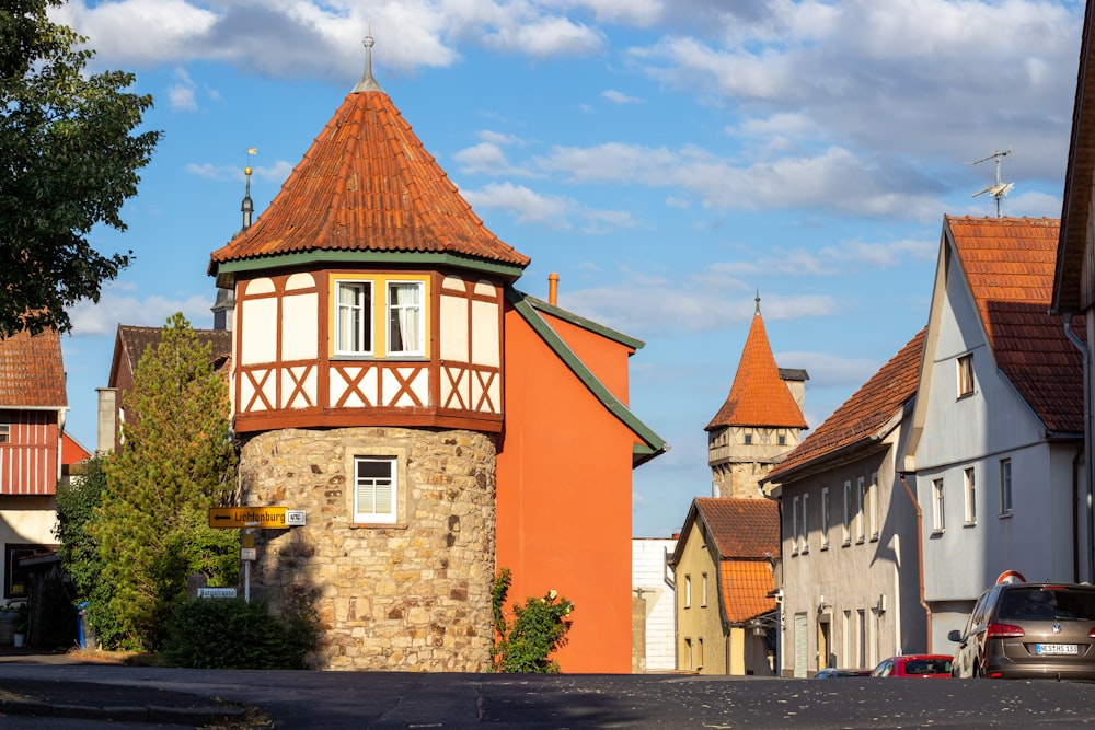 a red and white building sitting on the side of a road