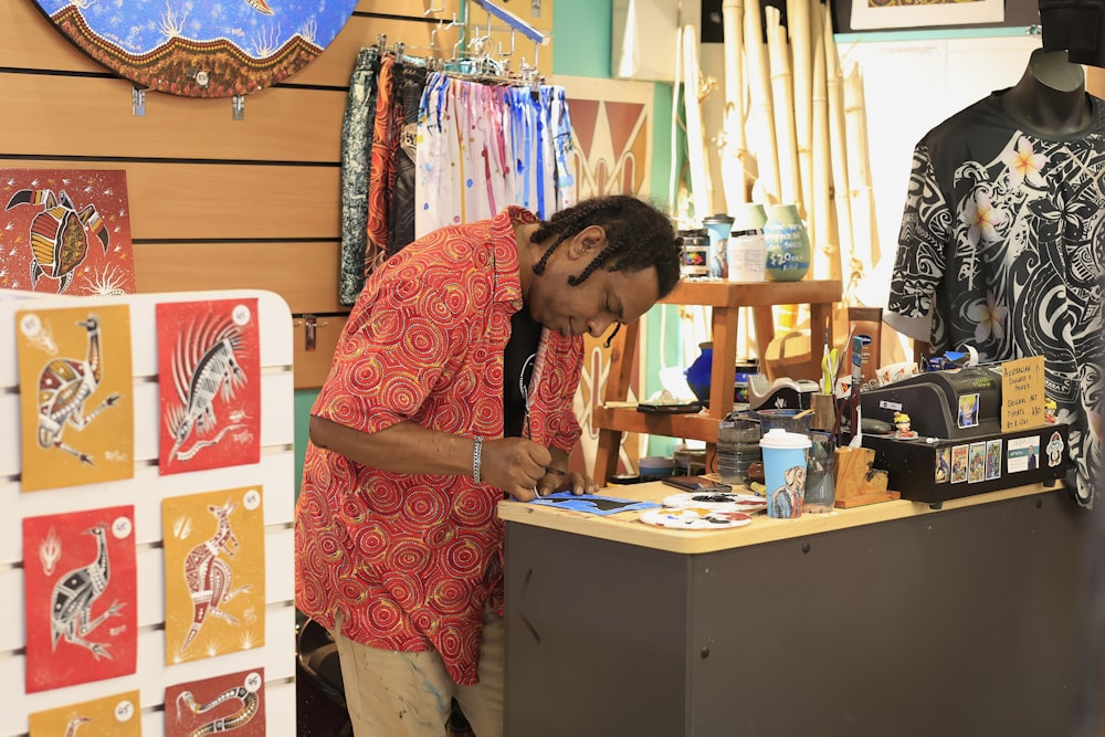 a man standing in front of a counter in a store