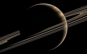 saturn with its rings in the dark sky