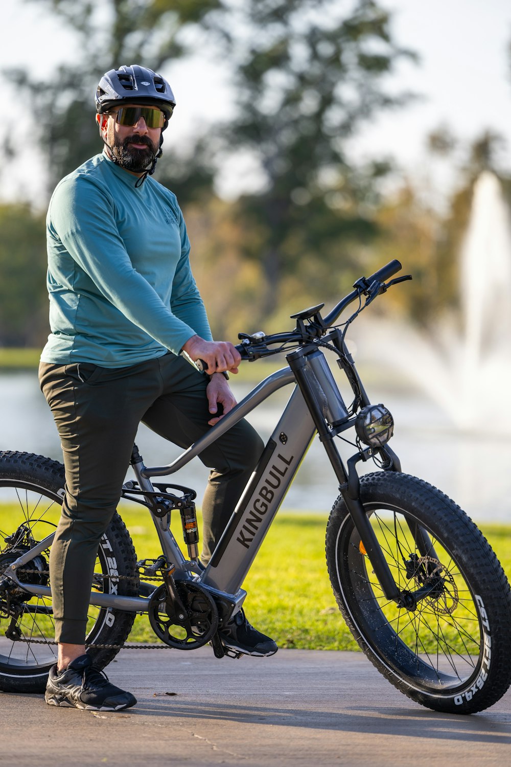 a man in a helmet is sitting on a bike