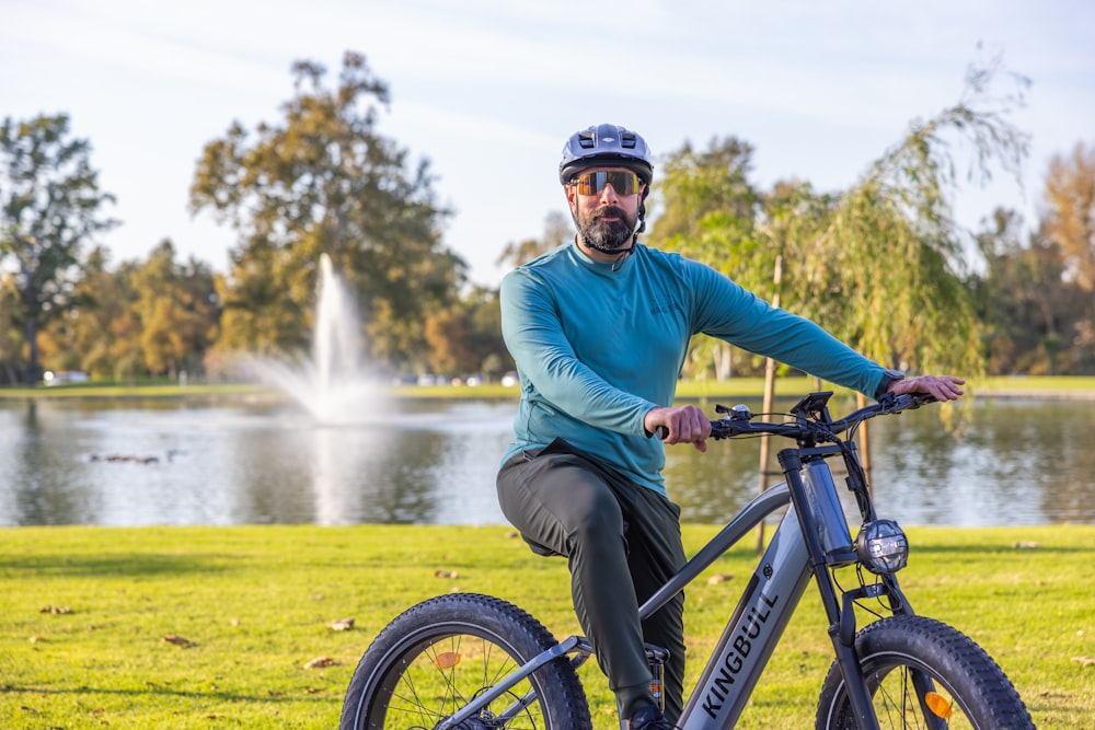 a man riding a bike in a park