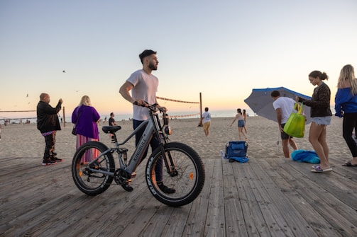 A group of happy tourists riding electric ezraiders along the scenic beach path in Pyla, Larnaca.