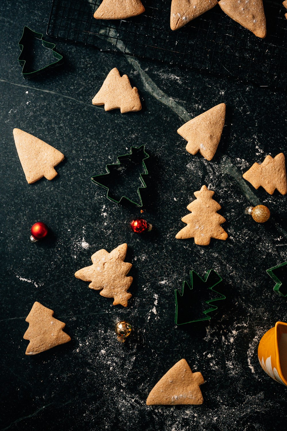 a table topped with cookies and christmas trees