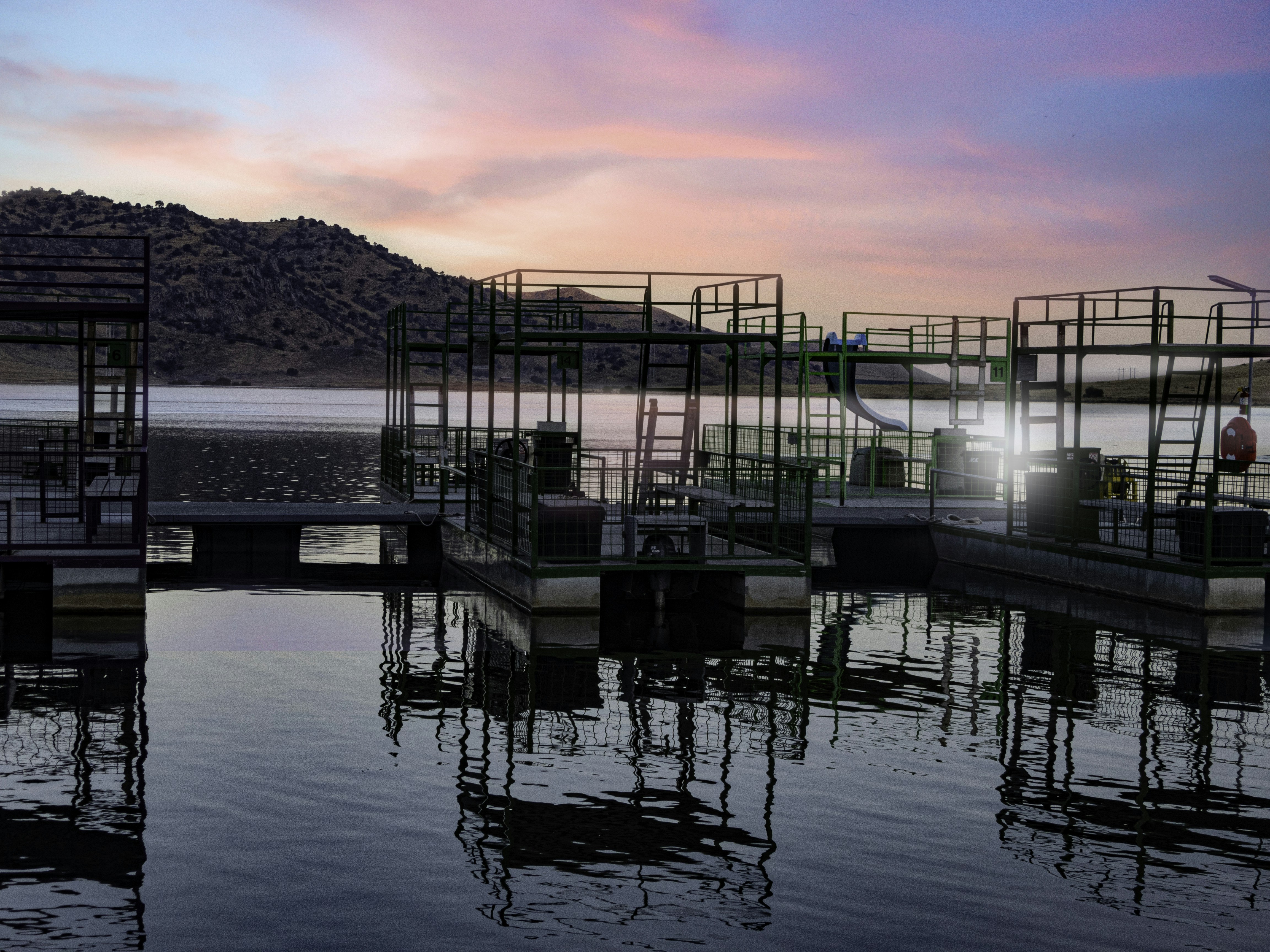 a group of docks sitting on top of a body of water