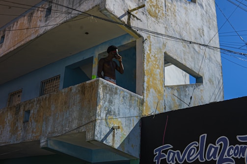 Photo of an electrician answering a phone call in a modern Parisian apartment.