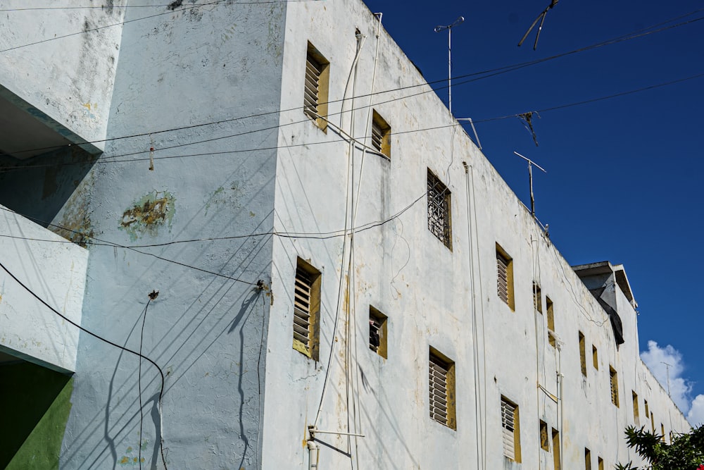 a tall white building with lots of windows