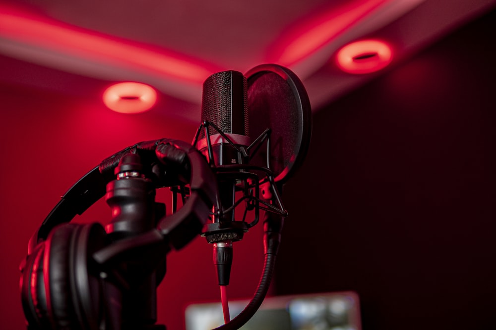 a microphone and headphones in a dark room