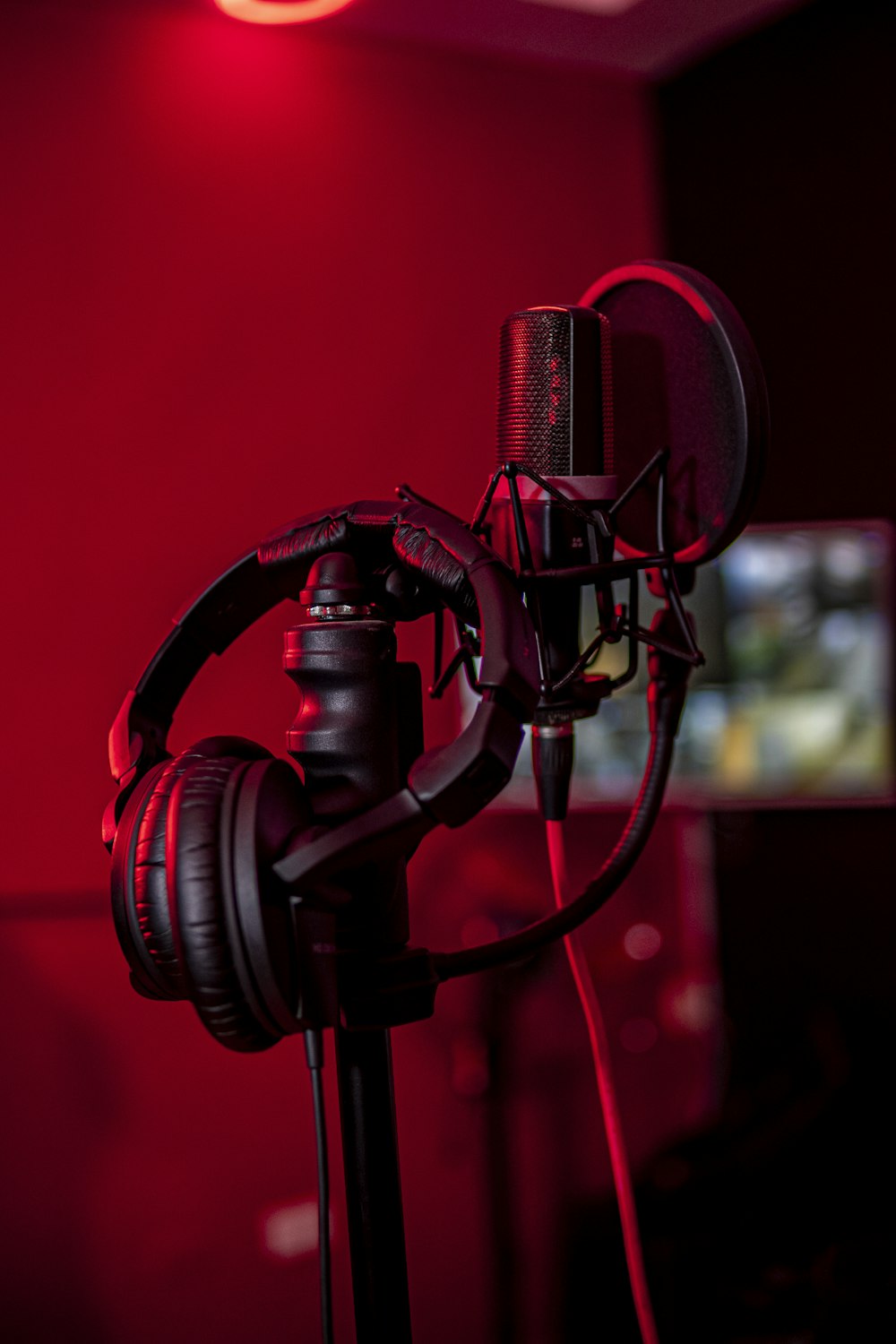a microphone and headphones in a dark room