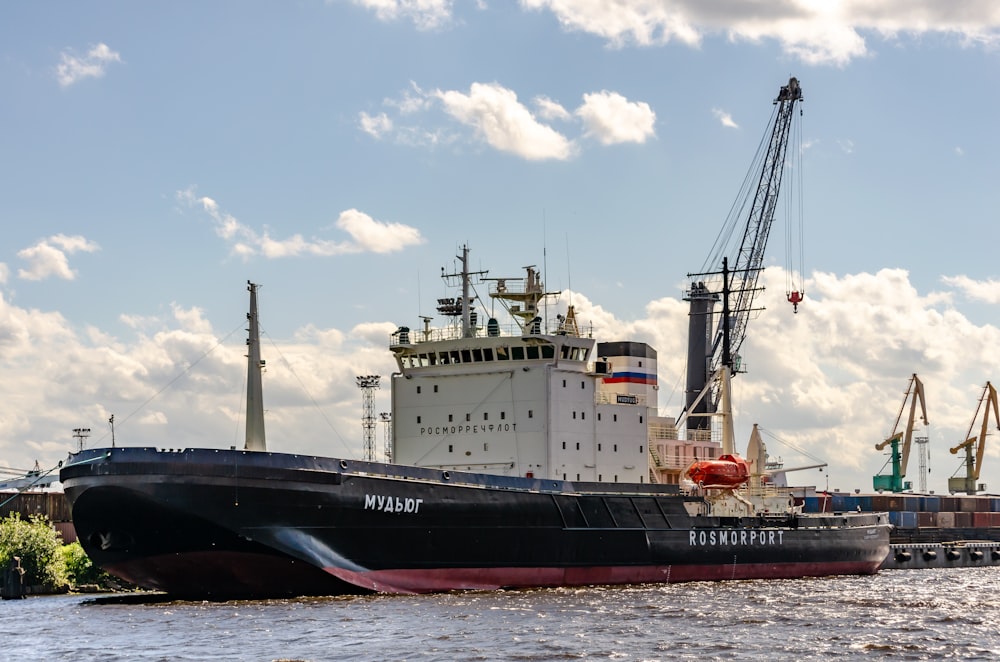 a large black and white boat in the water