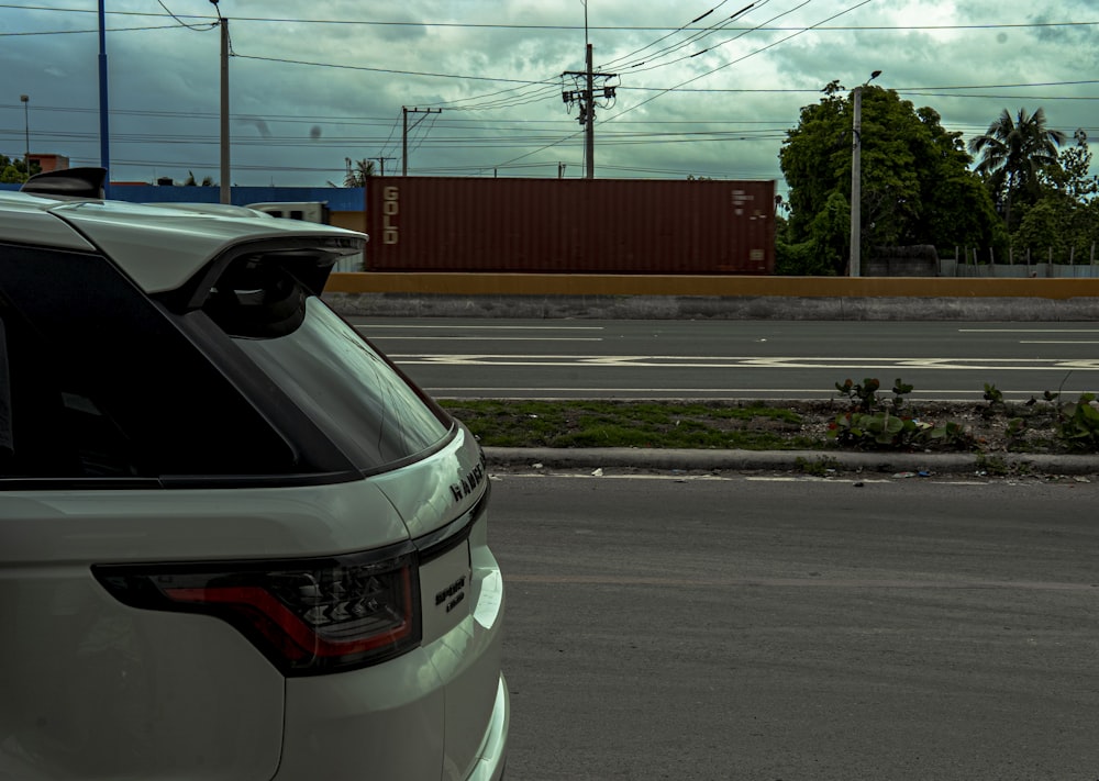 a white car parked on the side of the road