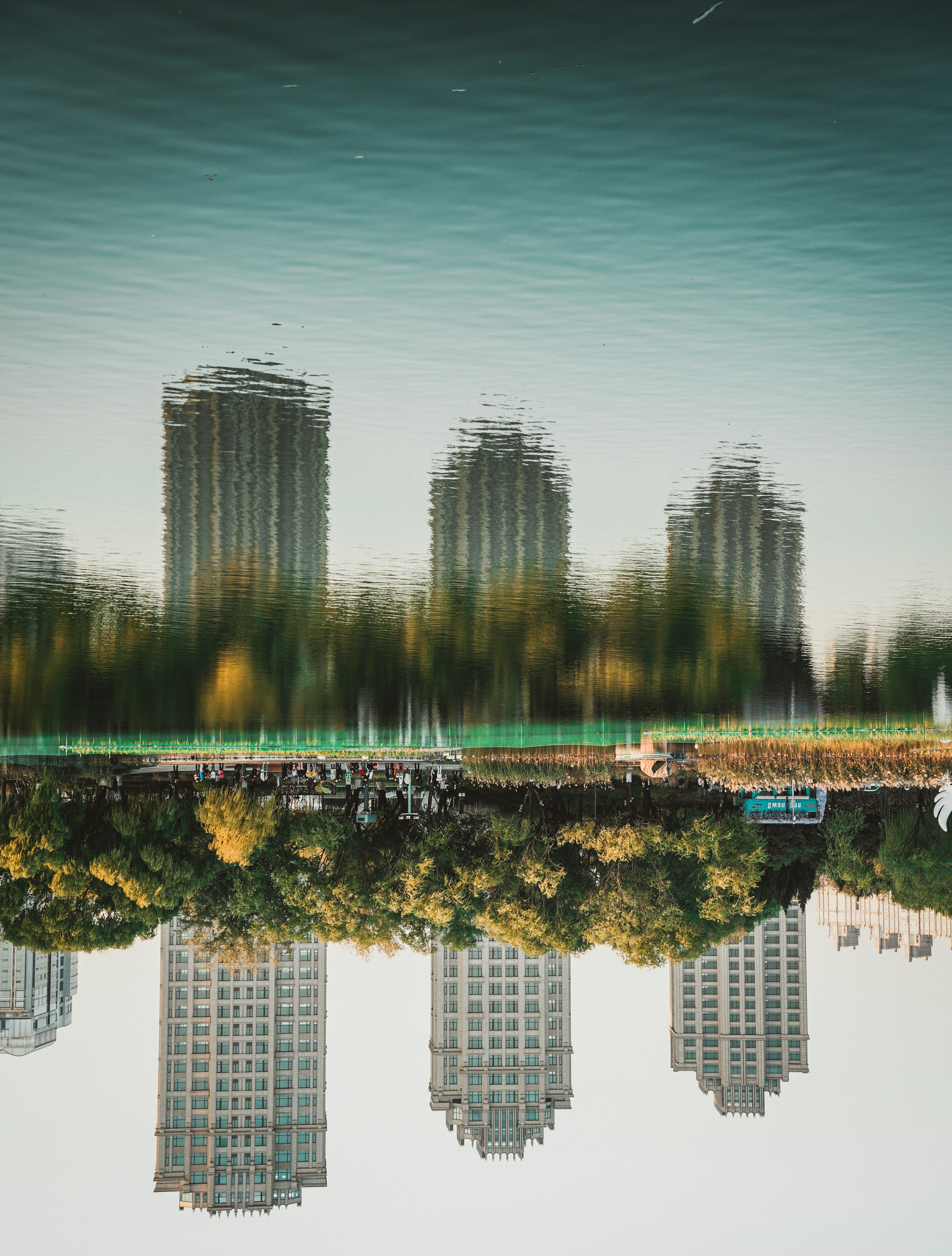 a reflection of a city in a body of water