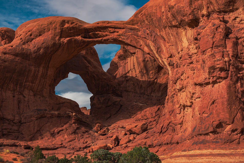 a large rock formation in the middle of a desert