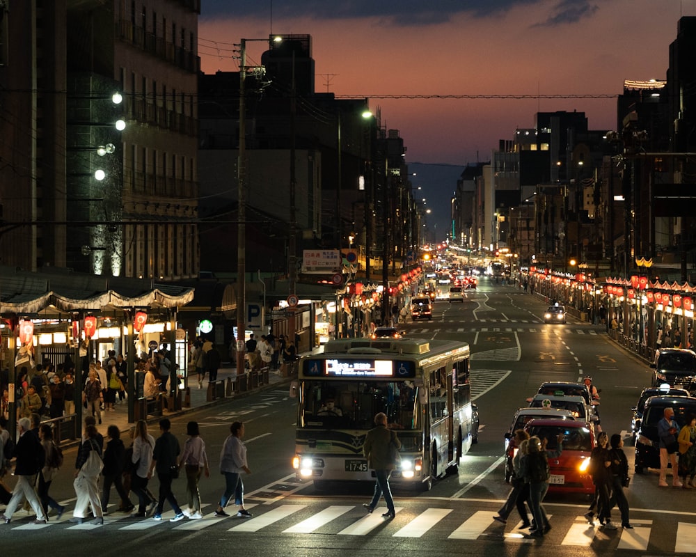 a city street filled with lots of traffic at night