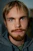 a close up of a person with a beard