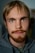a close up of a person with a beard