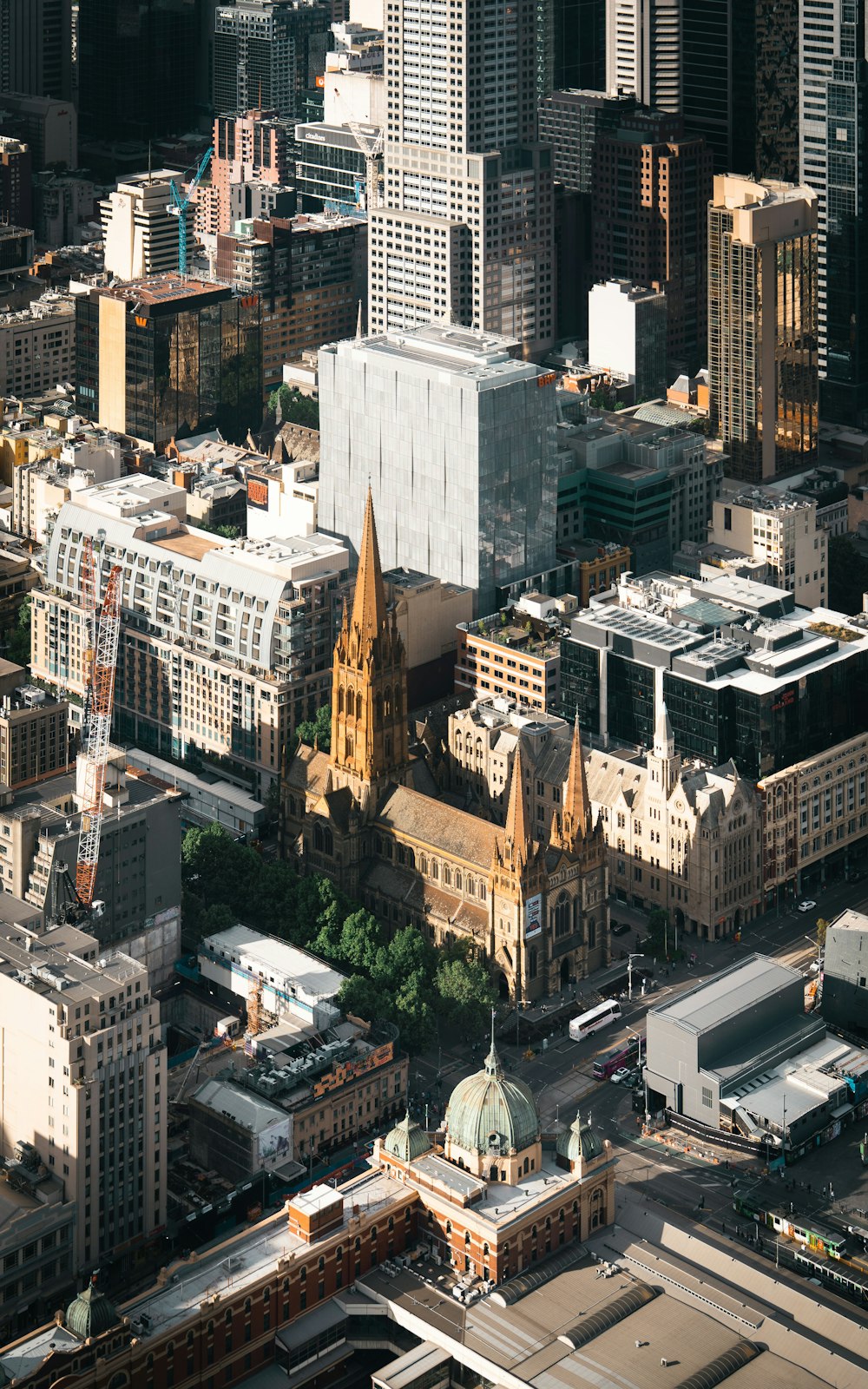 an aerial view of a city with tall buildings