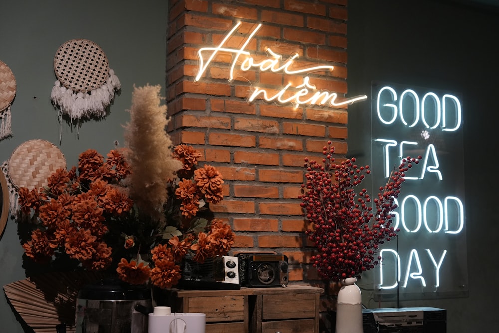 a brick wall with a neon sign above it