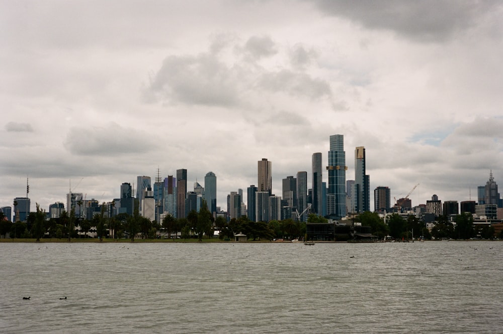 a large body of water with a city in the background