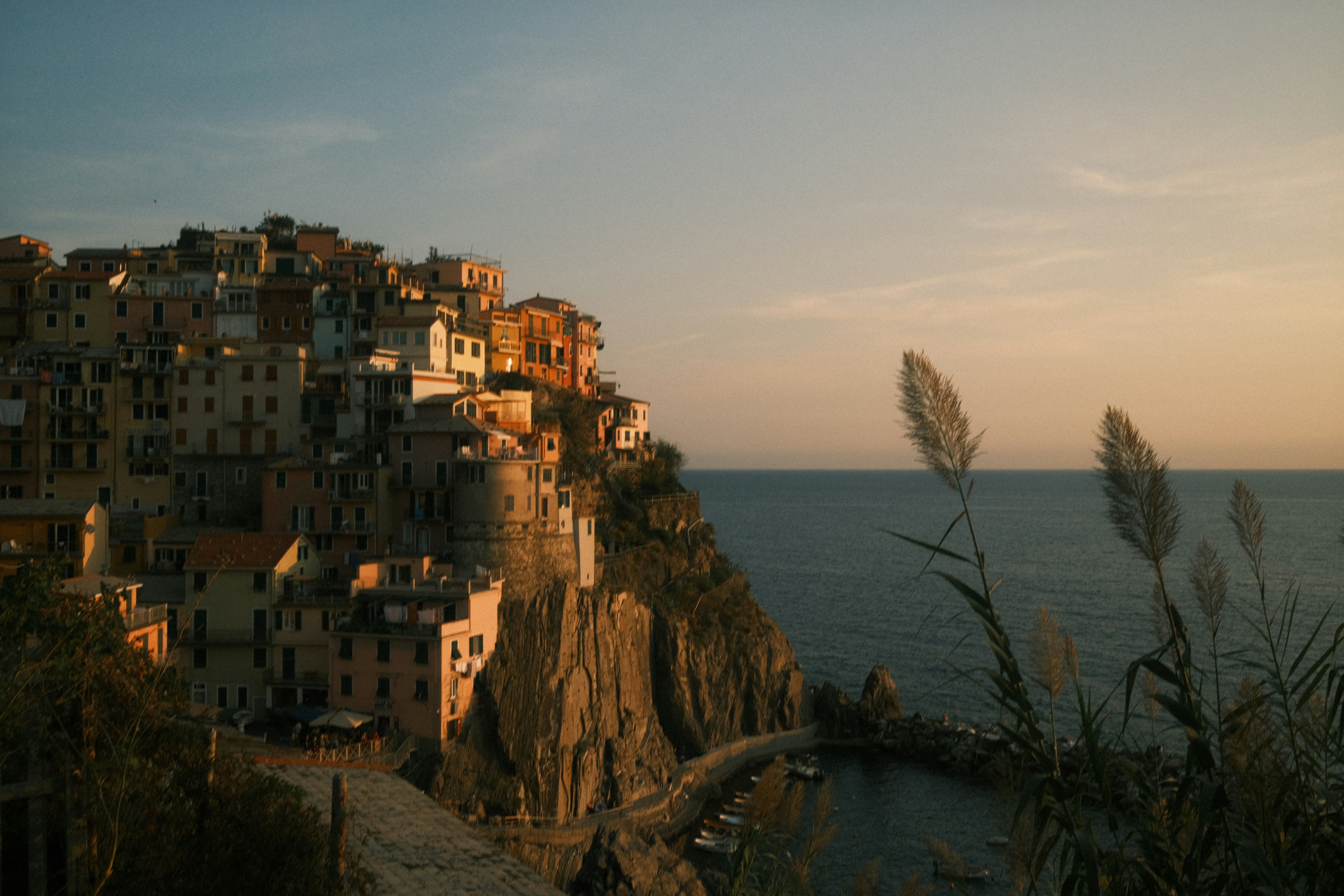 a small village on a cliff overlooking the ocean