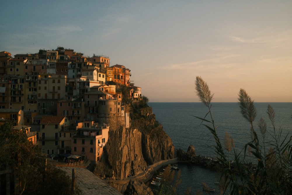 a small village on a cliff overlooking the ocean