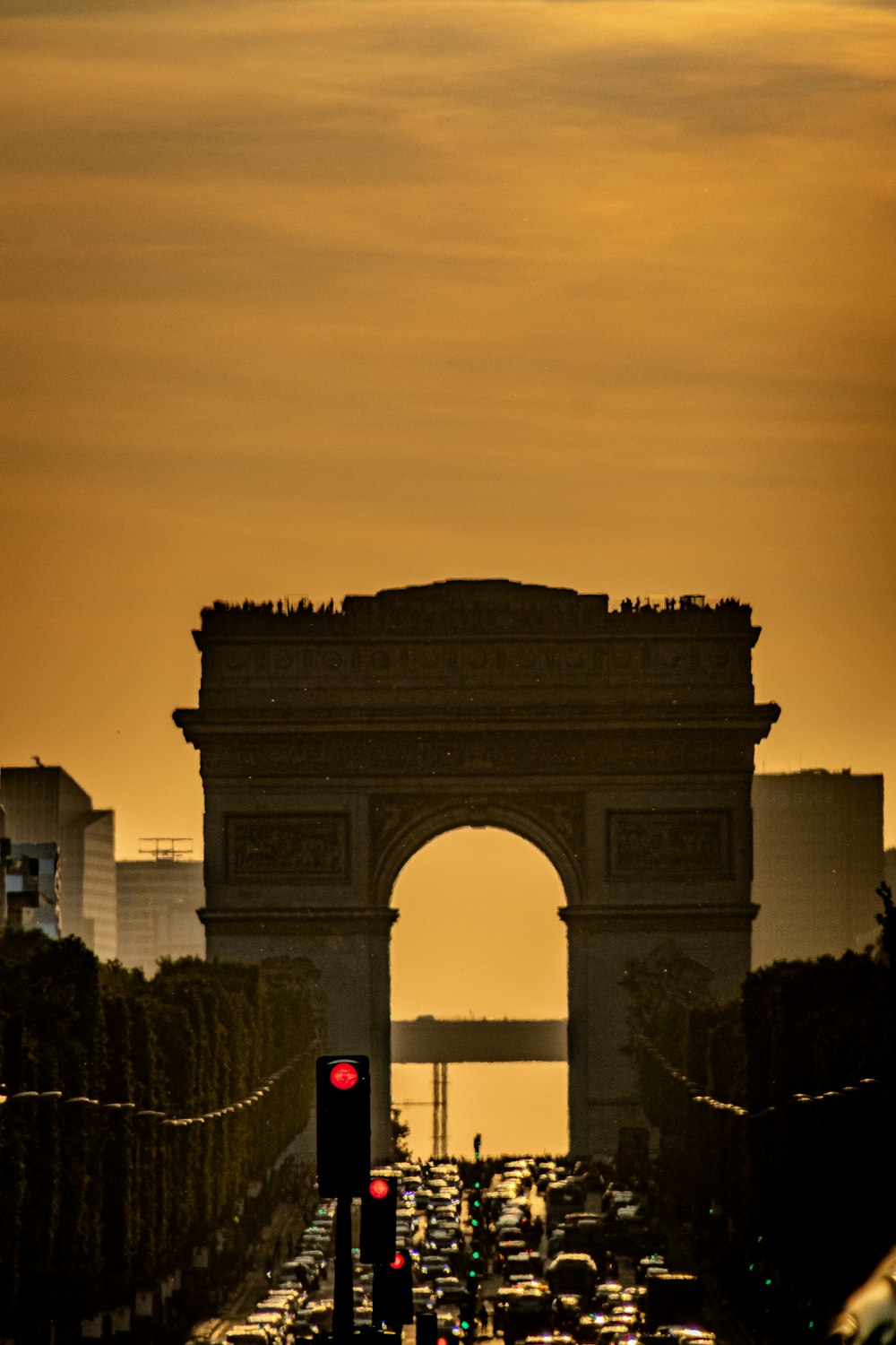 a traffic jam in front of the arc of triumph