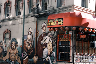 A professional photographer capturing a vibrant small business storefront in Tijuana.