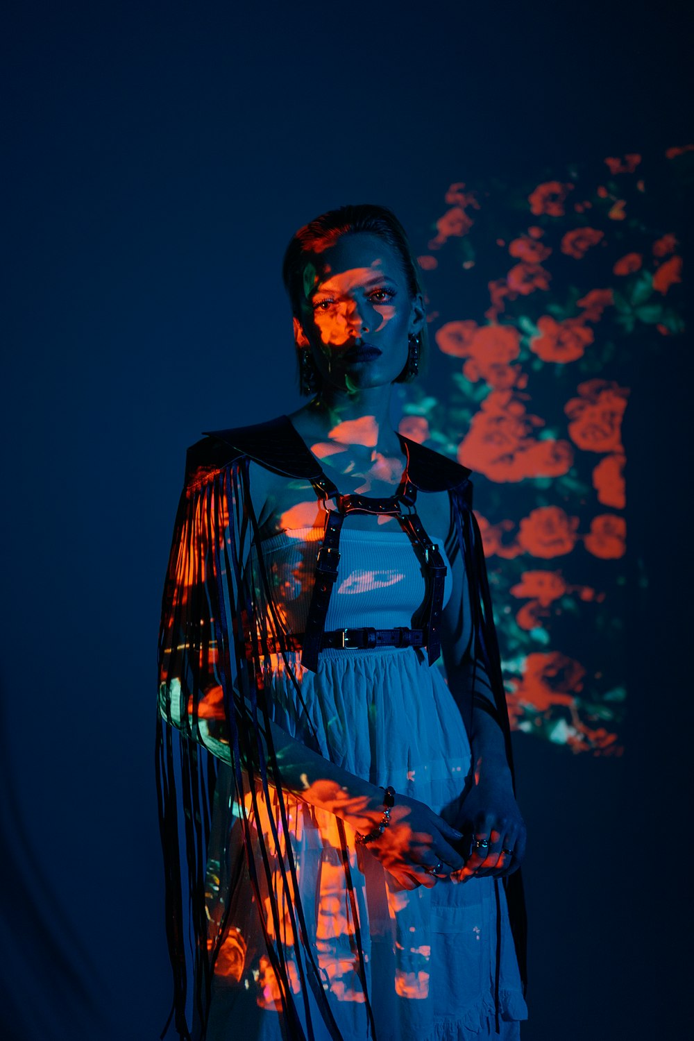 a woman standing in front of a projected image