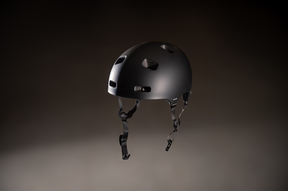 a black helmet with holes on the side of it