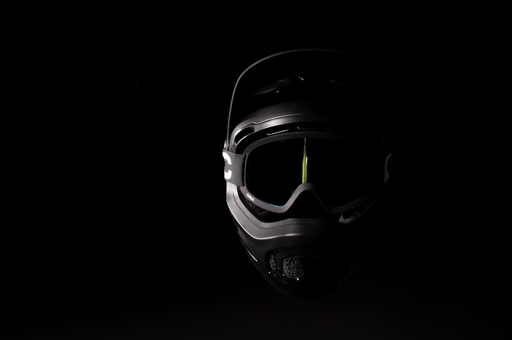 a helmet and goggles are shown in the dark