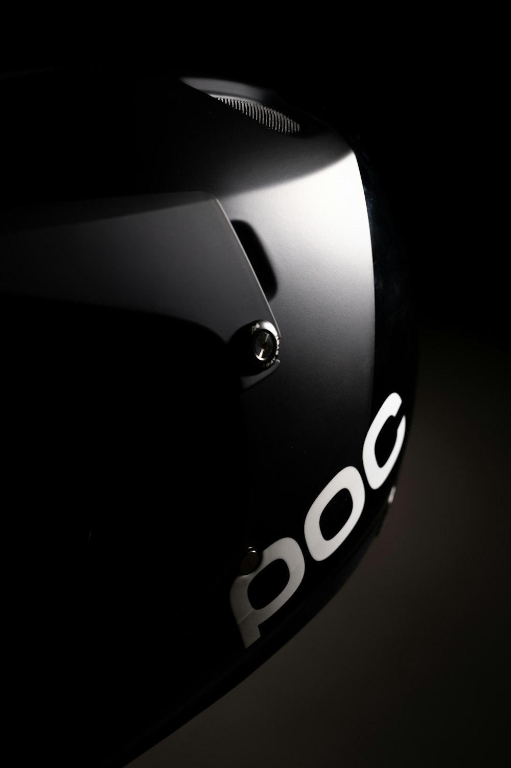 a close up of a helmet on a black background