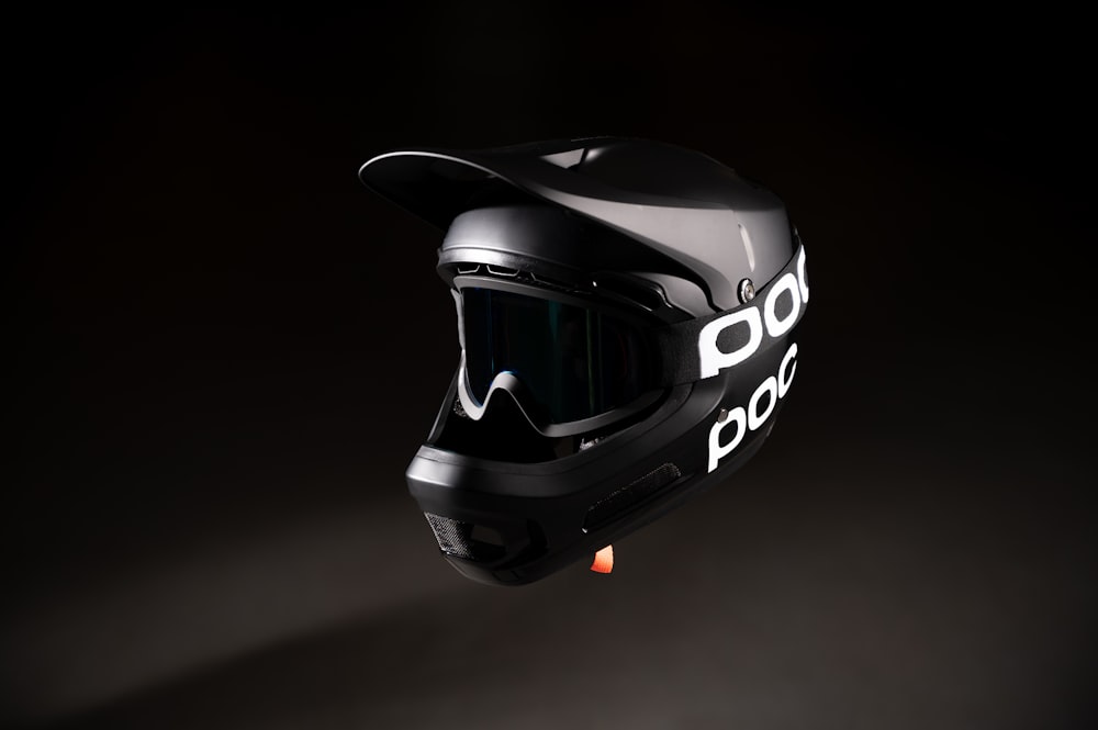 a black helmet with the word poco written on it