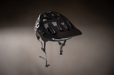 Helmet with a sleek design featuring ventilation and impact-resistant shell.