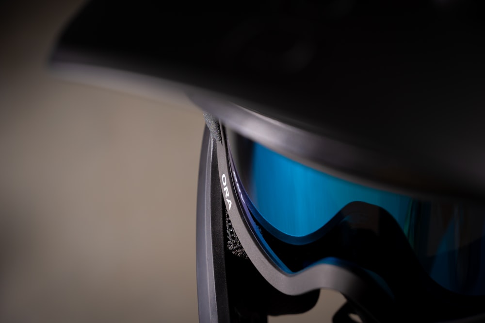 a close up of a ski goggles with a blue lens