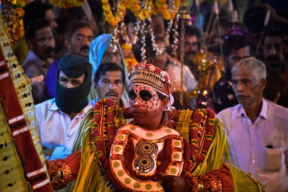 a man dressed in a costume and wearing a mask