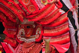 An elegant Bollywood-themed costume worn by an adult performer under bright stage lights.