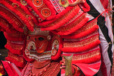 An elegant Bollywood-themed costume worn by an adult performer under bright stage lights.