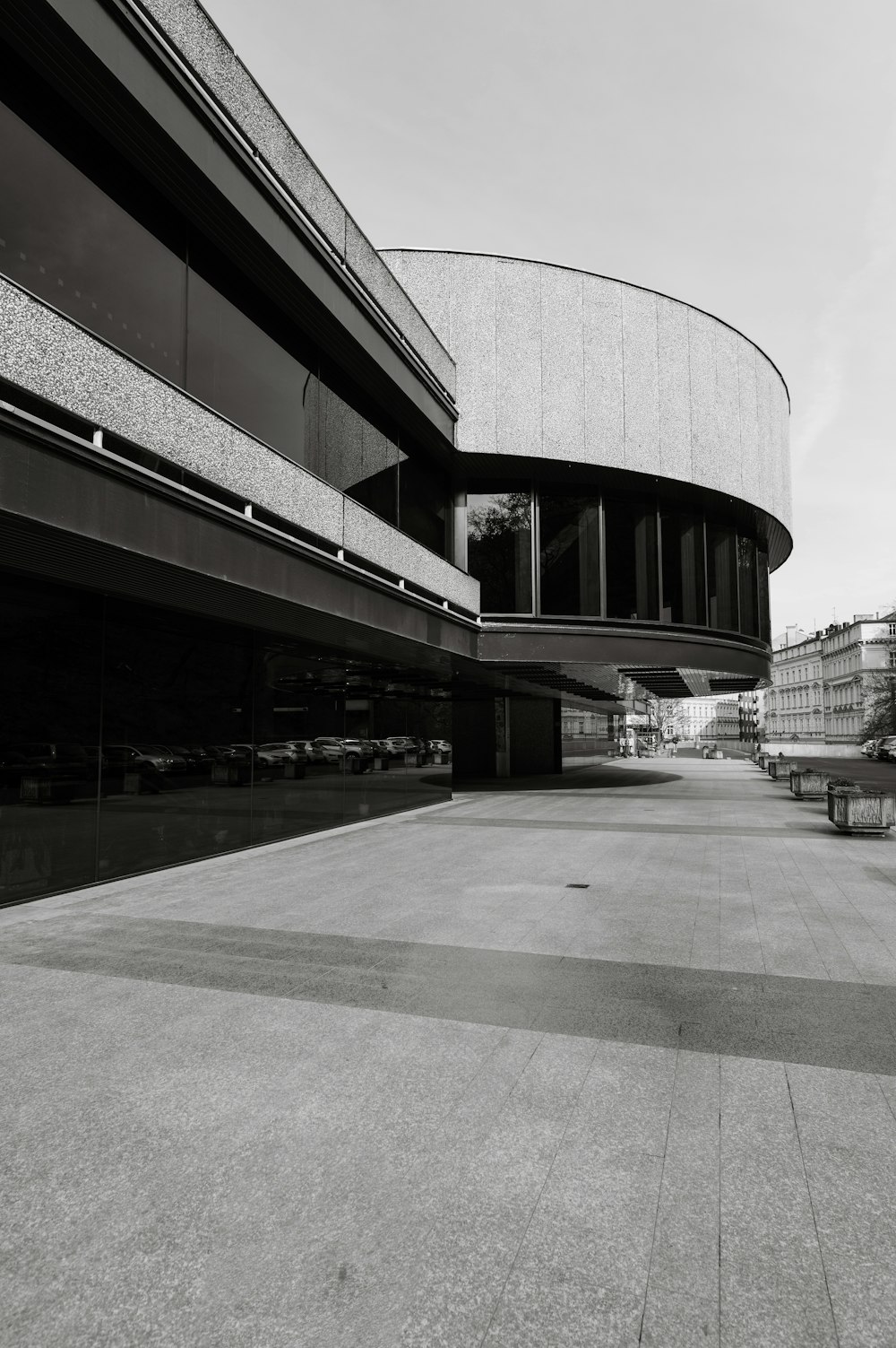 a black and white photo of an empty parking lot