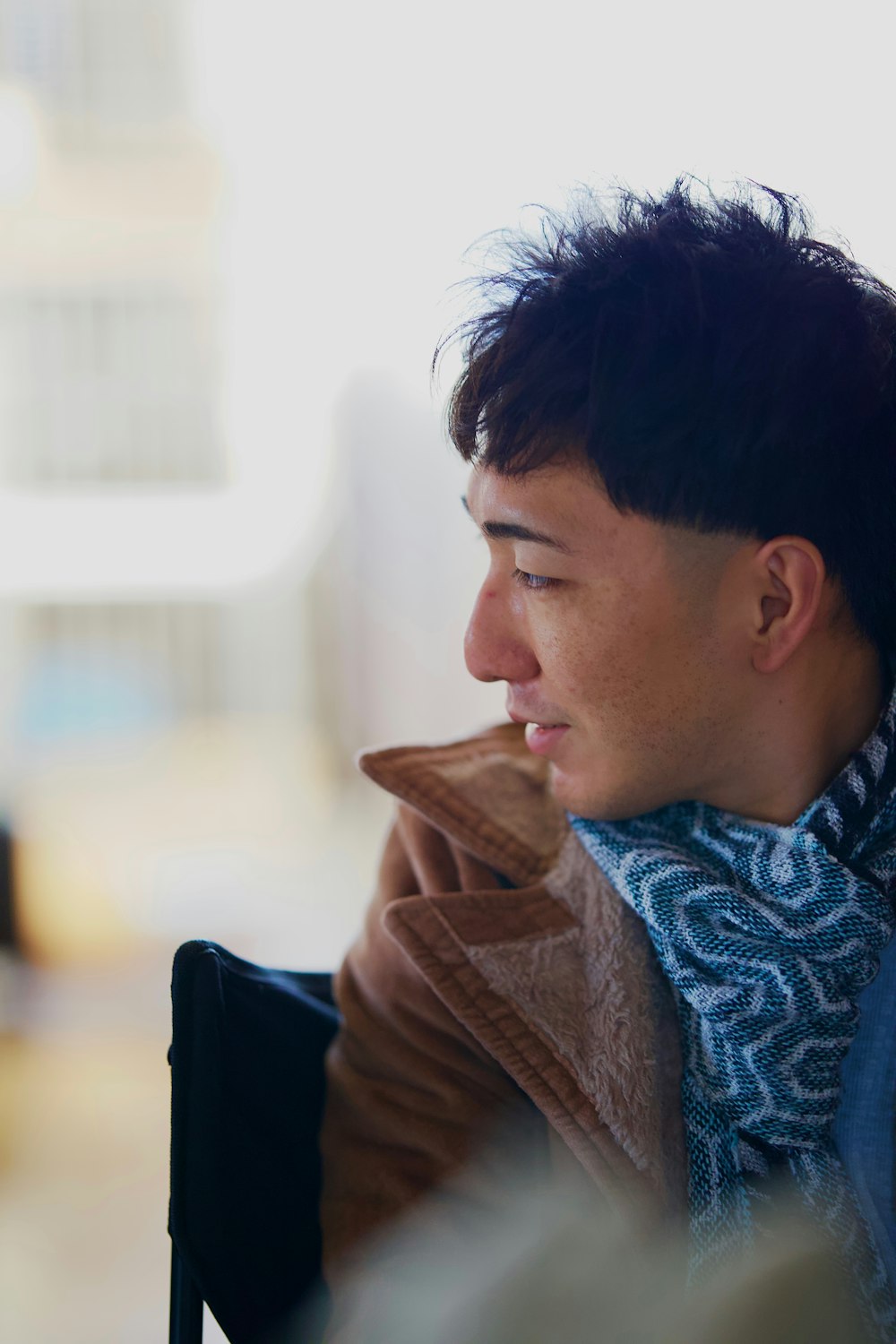 a man with a scarf around his neck