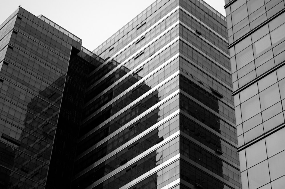 a black and white photo of two tall buildings