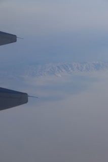 An aerial view of a CW Air Cargo plane flying over the mountains en route to Greece.