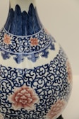 An intricate ceramic vase with floral patterns.