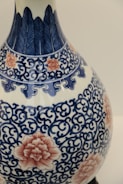 Decorative 3D printed vase with intricate patterns in blue tones.