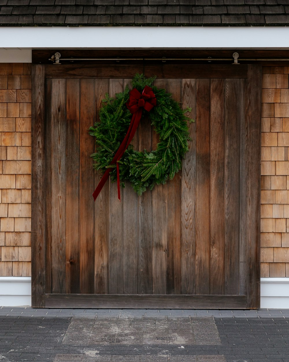 a wooden door with a wreath hanging on it