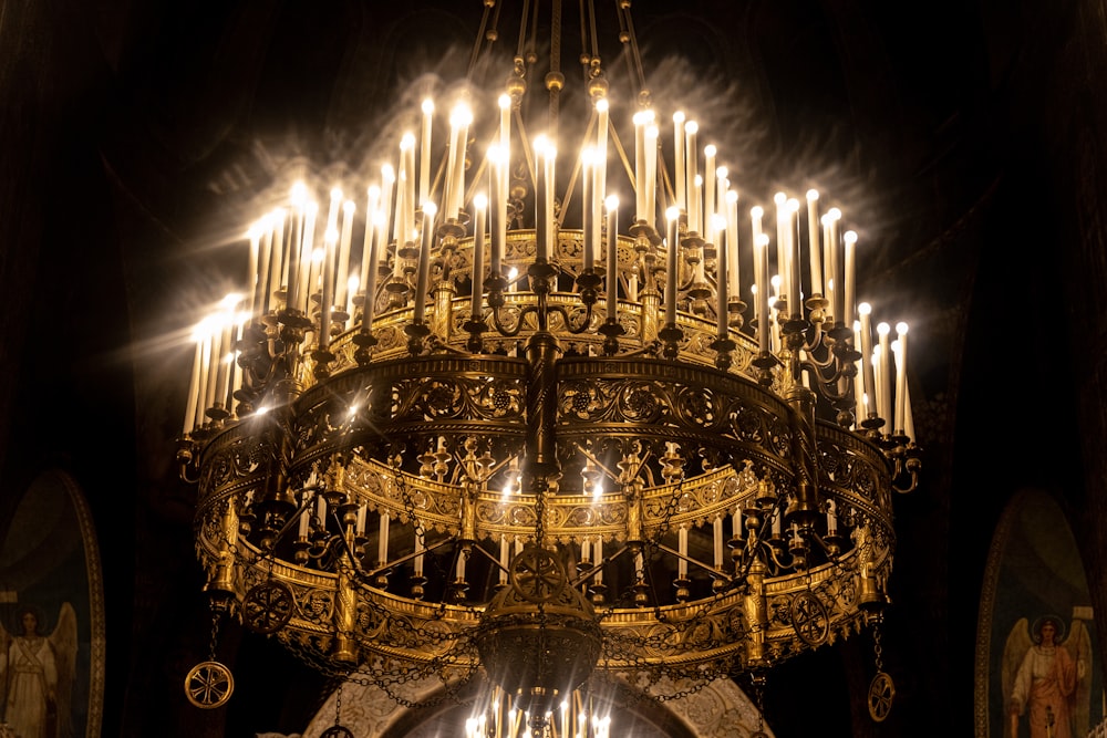 a chandelier in a church with a lot of candles