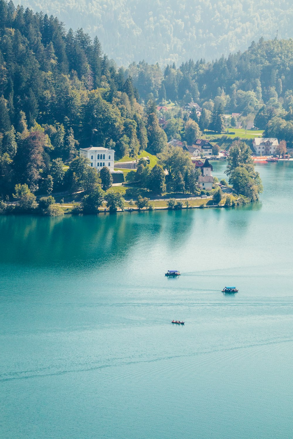 a group of boats floating on top of a lake